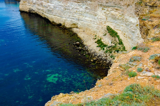 Clear water in a rocky bay.