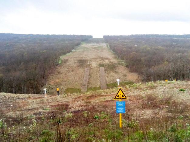 Photo a clearing in the forest for the gas pipeline