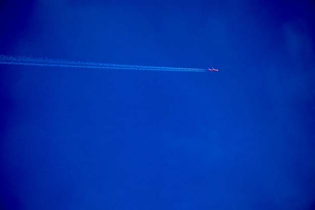 Clearly beautiful blue sky with white line plane