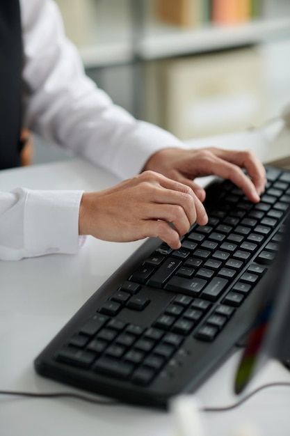 Clerk Typing on Keyboard