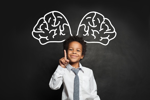 Clever black child student boy with big brain brainstorming and idea concept