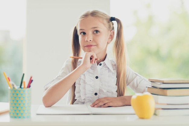 clever schoolgirl doing homework