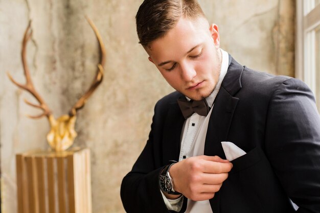 Clever young man employee future generation of businessman\
close up on old antique background