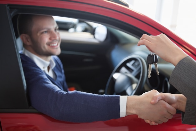 Client shaking hand to a woman