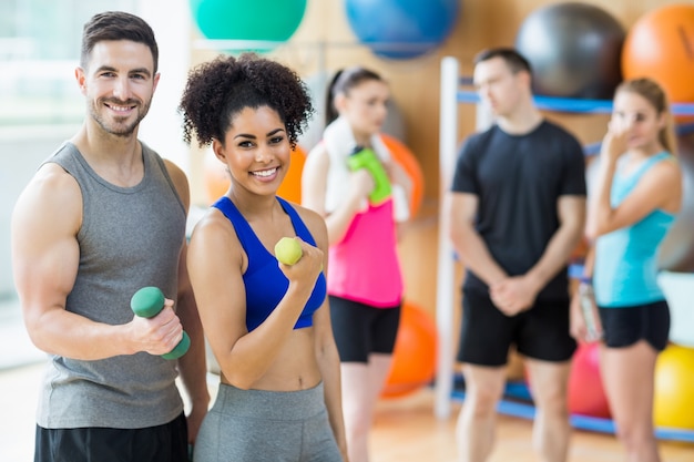 Client and trainer smiling at camera