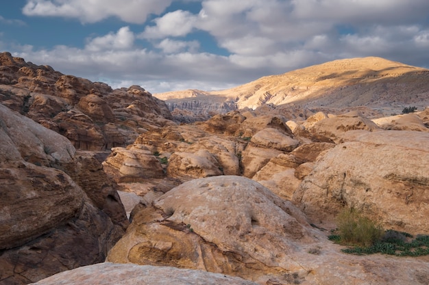 Cliffs of light limestone in the desert mountains near the city of Wadi Musa in the Petra National Park in Jordan