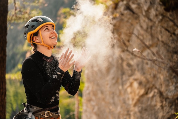 Climber wearing in climbing equipment Practicing rockclimbing on a rock mountain wall Climbing sports and bouldering concept rock climber climbs on a rocky wall