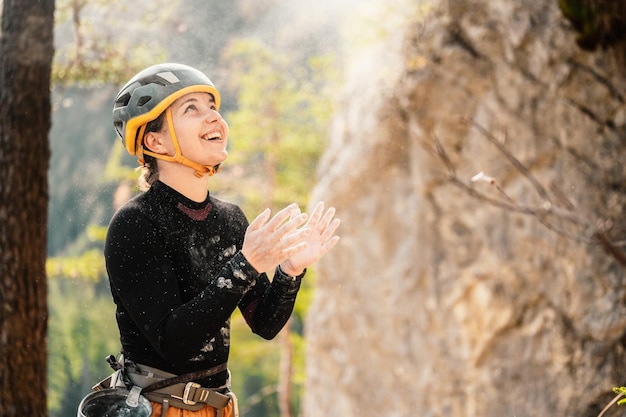 Climber wearing in climbing equipment Practicing rockclimbing on a rock mountain wall Climbing sports and bouldering concept rock climber climbs on a rocky wall