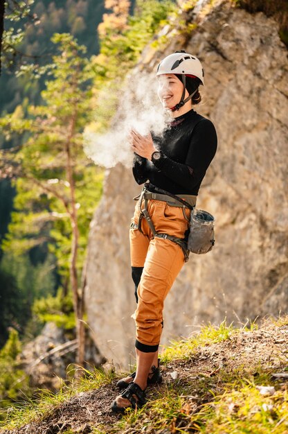 Climber wearing in climbing equipment Practicing rockclimbing on a rock mountain wall Climbing sports and bouldering concept rock climber climbs on a rocky wall