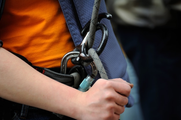 climber with equipment for climbing (carabiner and rope)