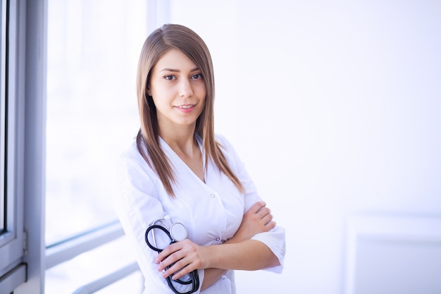 Clinic. Cheerful Doctor working at her office