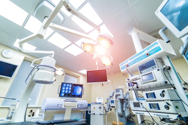 Clinic interior with operating surgery table.