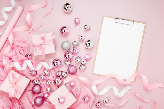 Clipboard mockup  Christmas decor. Arrangement in pastel pink colors.