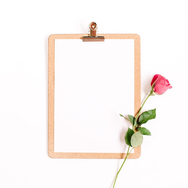 Clipboard and pink rose flower