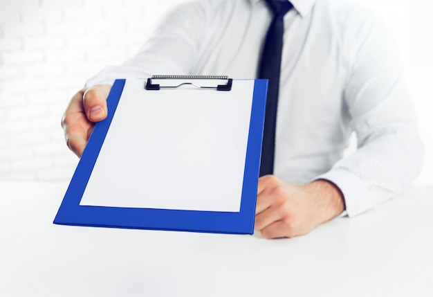 Clipboard on a white table. close up