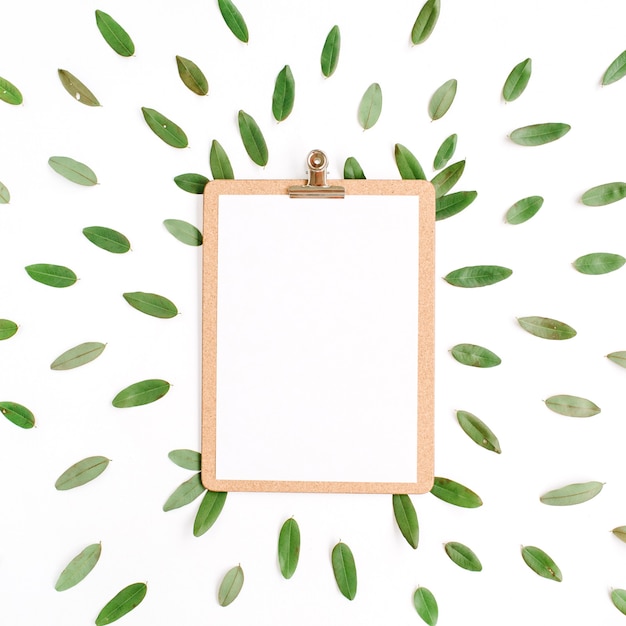 Clipboard with green petals isolated on white