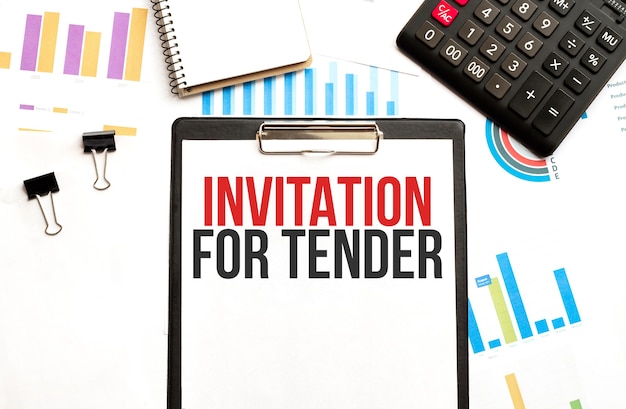 clipboard with text INVITATION FOR TENDER