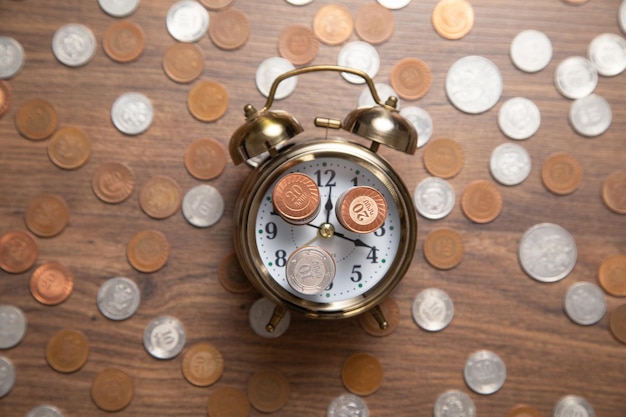 Clock and coins Business concept