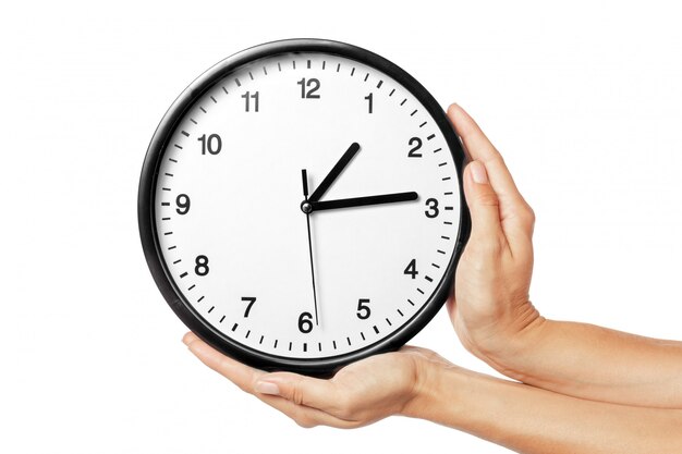 Clock in hands isolated on white