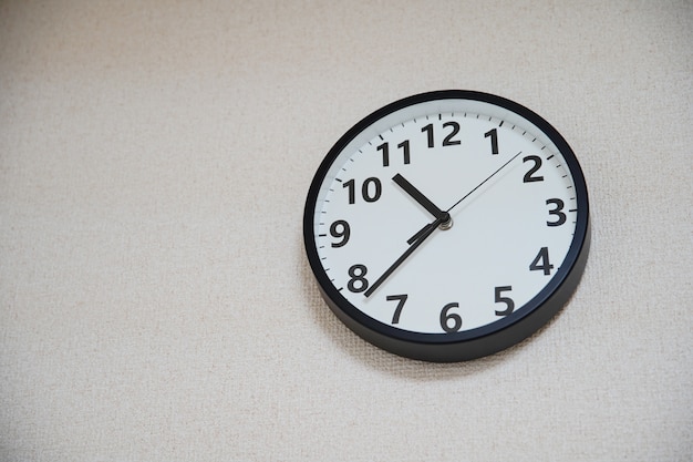 Clock installed on the wall of a room