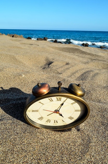 Clock on the Sand Beach