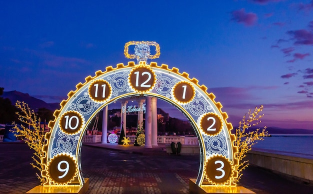 A clock that is lit up with the numbers 12 and 12.