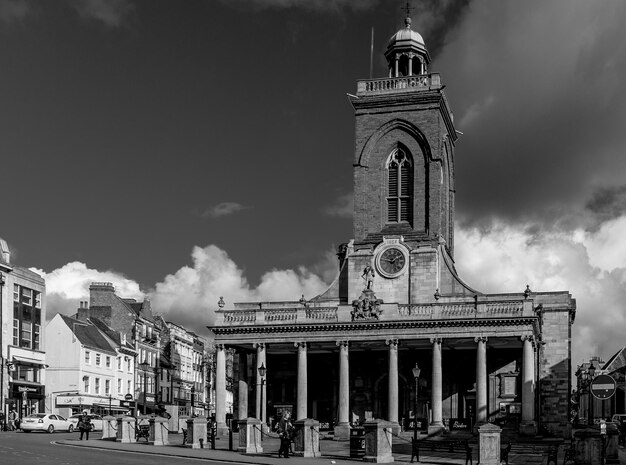 Clock tower against sky and clouds