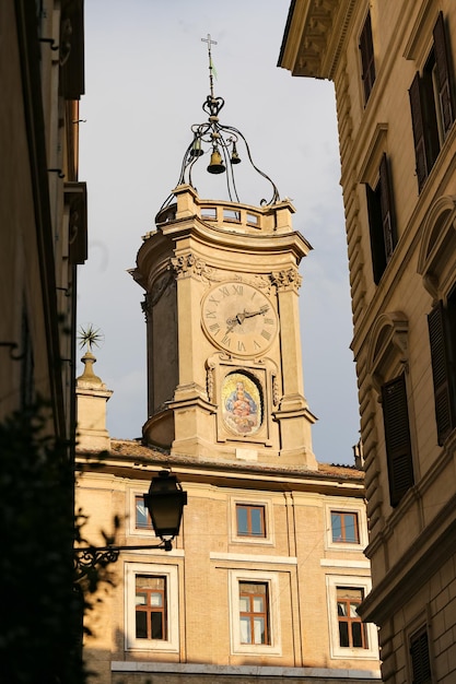 Clock Tower over a Building in Rome Italy