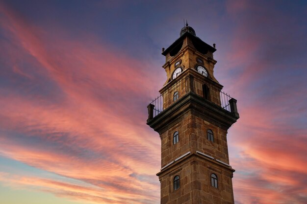 A clock tower with the time of 12 : 30