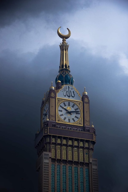 A clock tower with the time of three on it