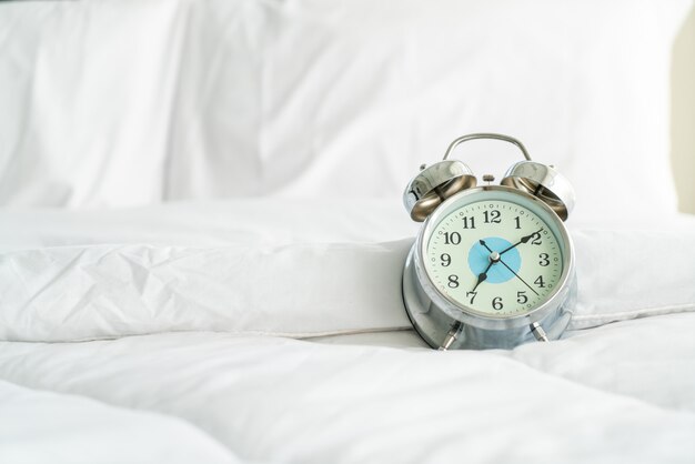 clock on white bed