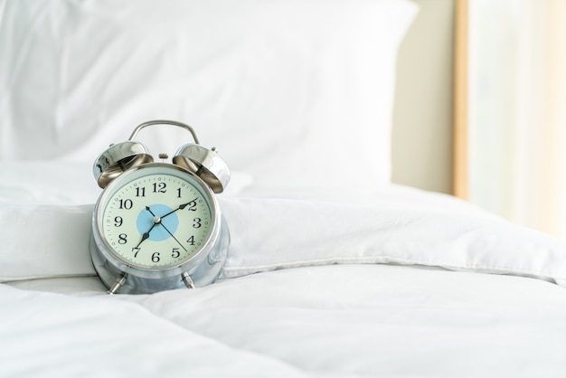 clock on white bed