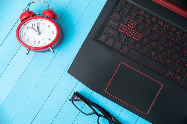 Photo clock with glasses and notebook