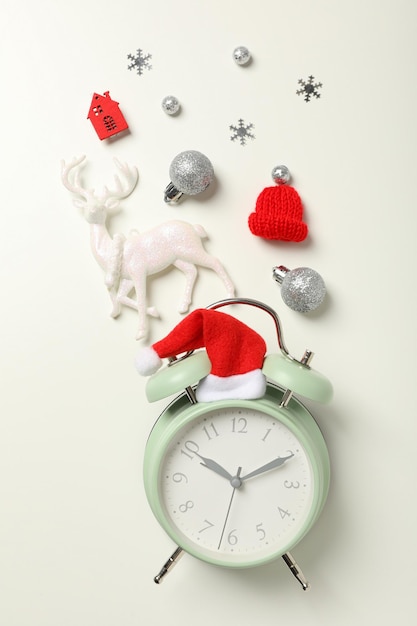 A clock with a Santa hat with a New Year's decoration