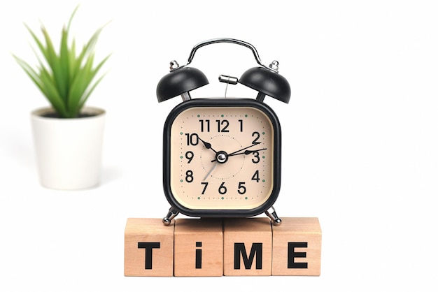 Clock with time message on wooden block