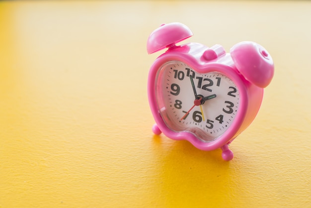 Photo clock on wood table - vintage filter