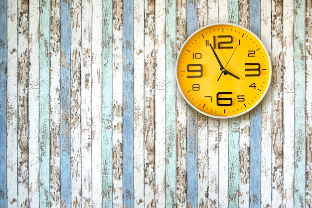 Clock on the wood wall.