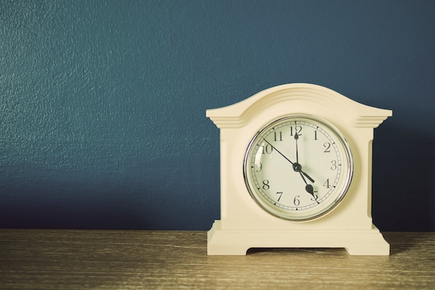 clock on wooden table