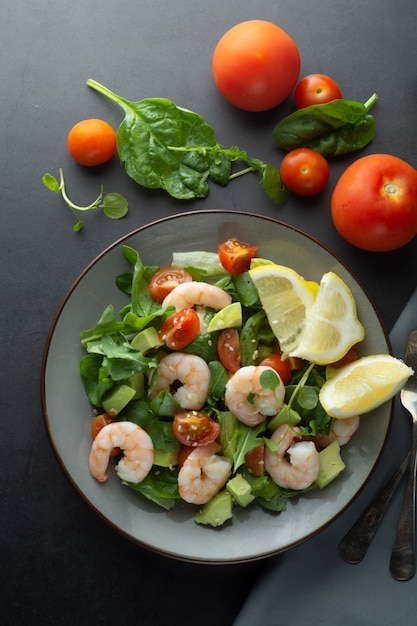 Cloos up salad with avocado and shrimps. Healthy fresh salad.