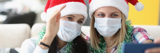 Close friends wear festive hats