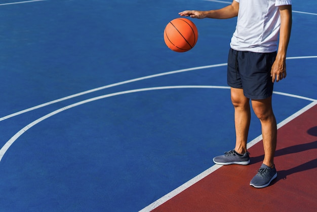 Close of a man dribbling the ball