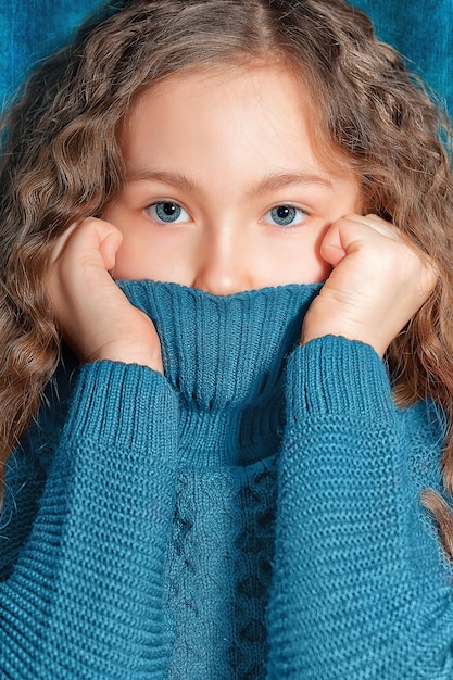 Close portrait of a girl with long hair at home