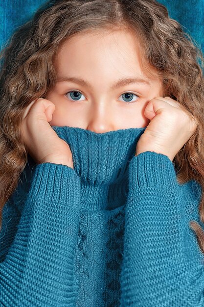 Close portrait of a girl with long hair at home