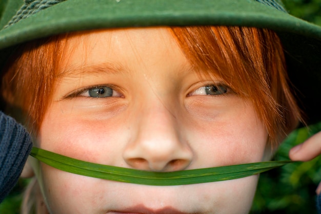 Close shot of a boy of eight years old with red hair childhood concept