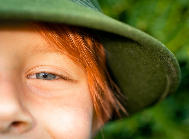 Close shot of a boy of eight years old with red hair childhood concept