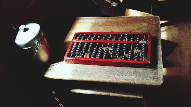 Photo close-up of abacus on table