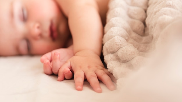 Photo close up of adorable baby hand