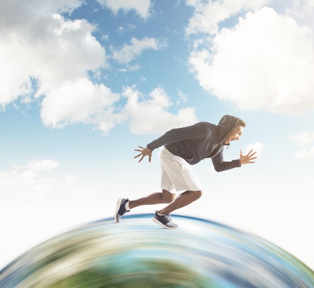 Close up of African guy running on the globe