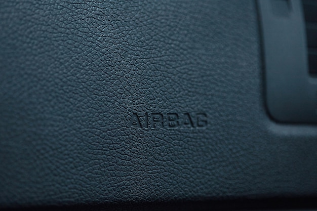 Photo close up of airbag steering wheel symbol