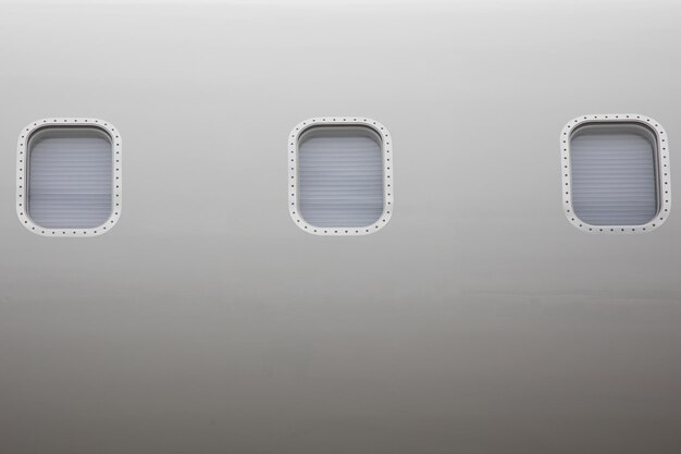 Photo close up of an airplane windows of private business jet